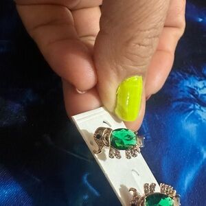Gold Tone.              Elefant Earrings with Emerald Green Stones
